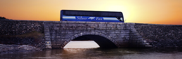 silver fox coach bus at sunset